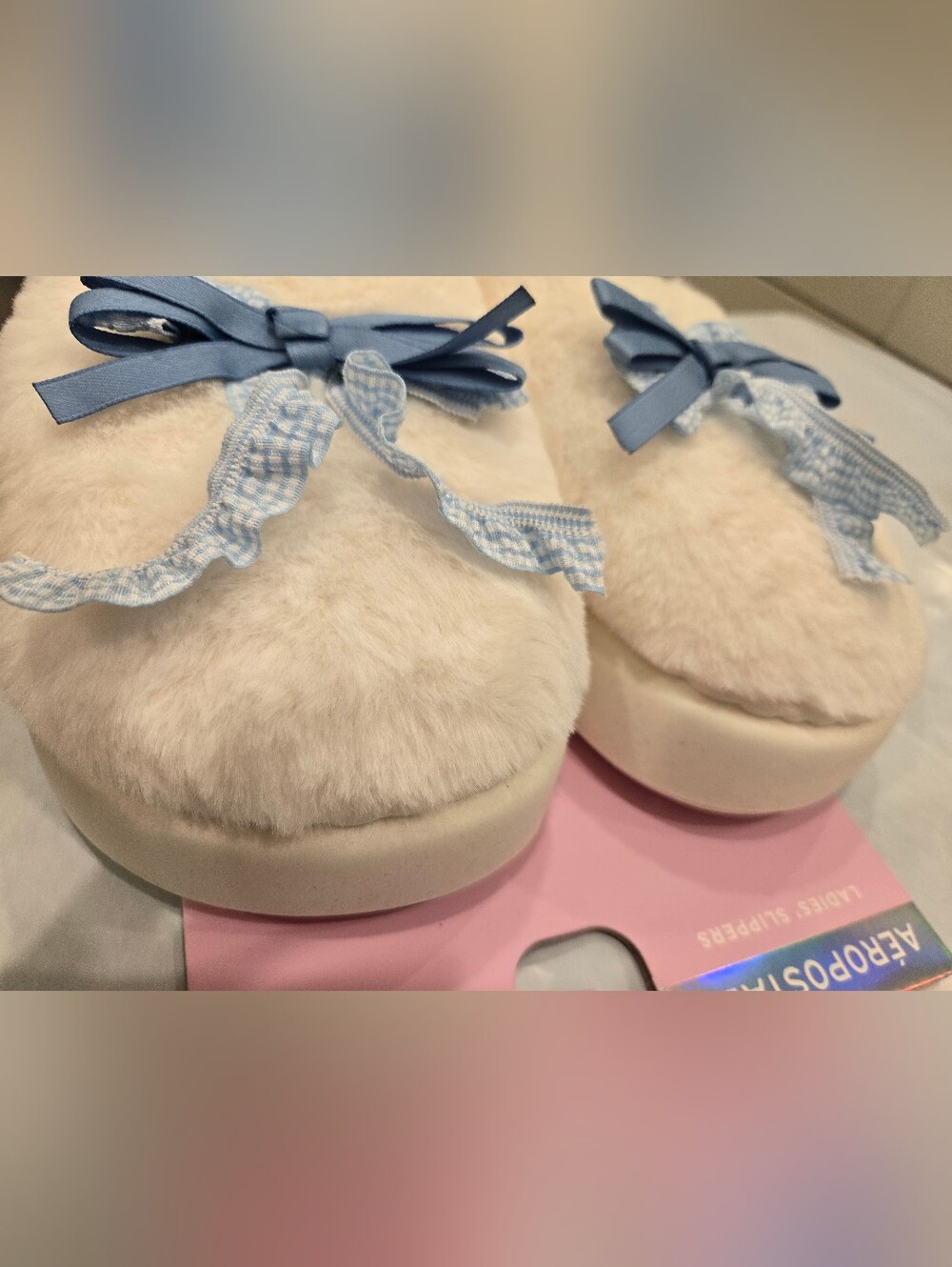 Aeropostale Cream Fuzzy Slippers with Light Blue Ribbon Accents. BLUE0132